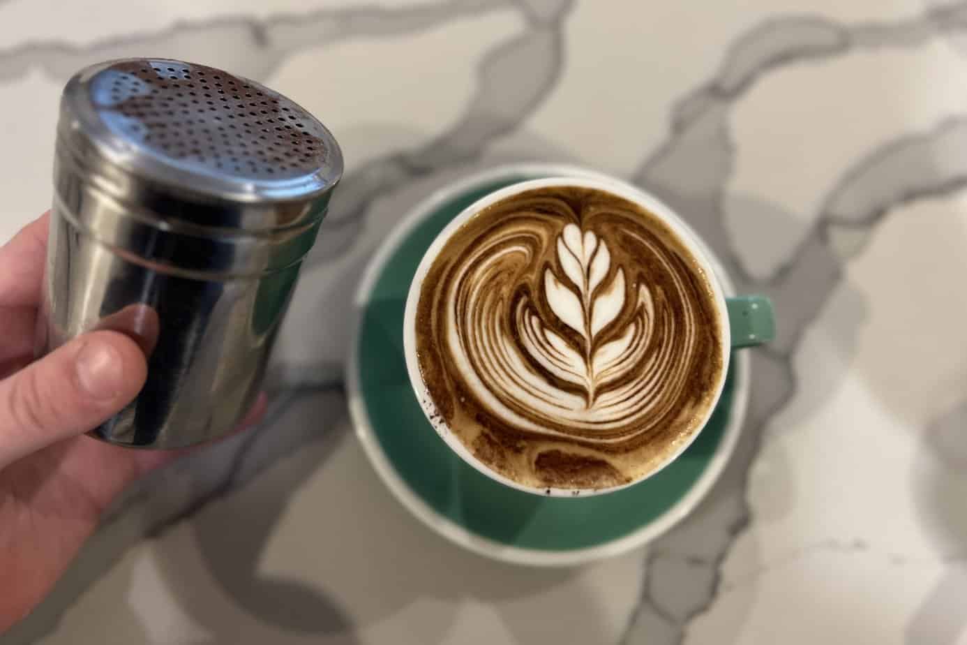 Latte art with cocoa shaker